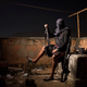 “A drug gang leader poses for a photo in a slum in Rio de Janeiro, Brazil. He told Associated Press journalists that drug dealers win the hearts and minds of locals by paying for food and medicine, providing a lifeline for many living in crushing poverty.”